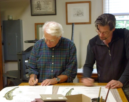 Michael Delp and Chad Pastotnik signing the edition.
